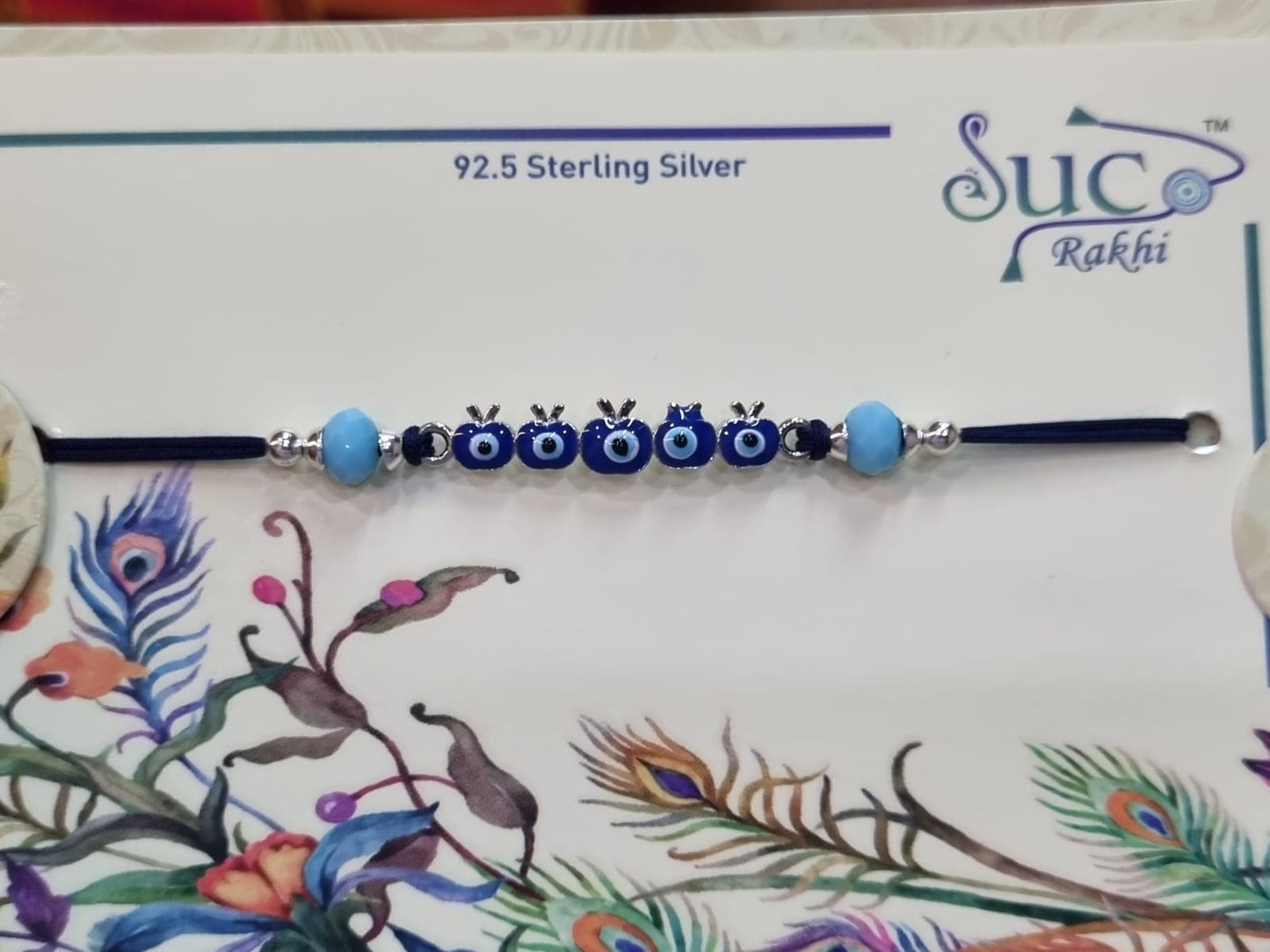 Sterling Silver Rakhi with Evil eye in apples Design